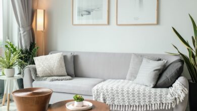 a living room filled with furniture and a large window